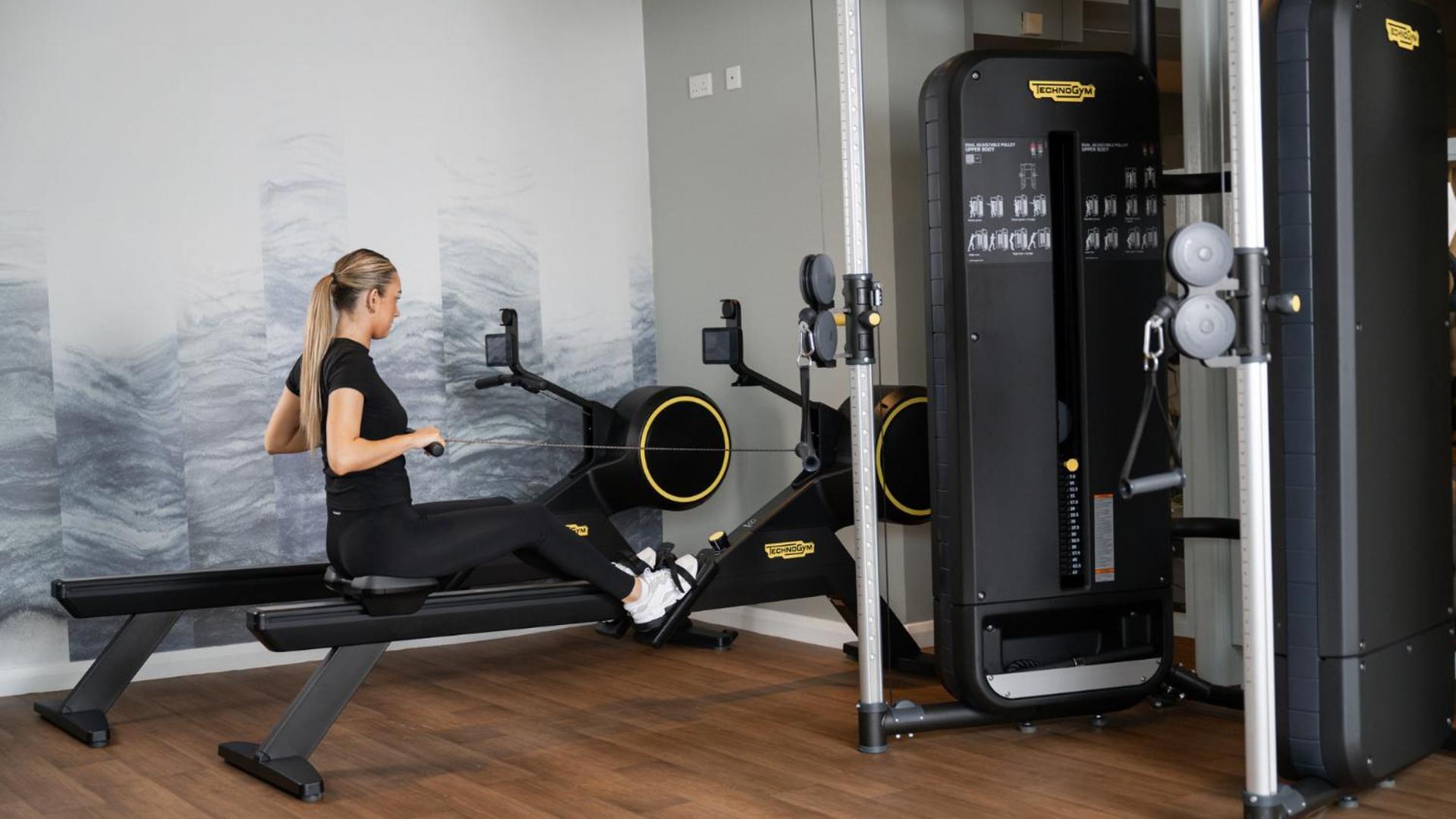 The Culloden Estate And Spa Holywood  Bagian luar foto A woman using a rowing machine